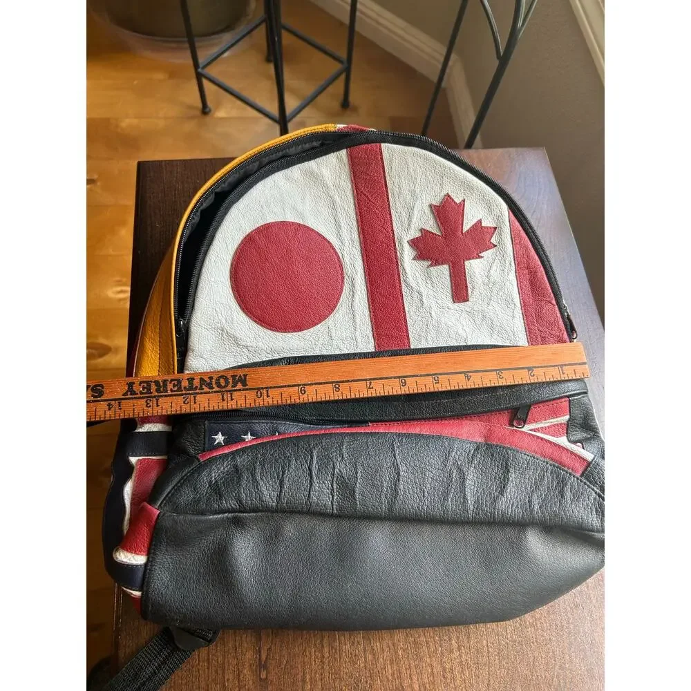 Vintage Wilsons Leather Multi-National backpack leather flag USA Japan Canada